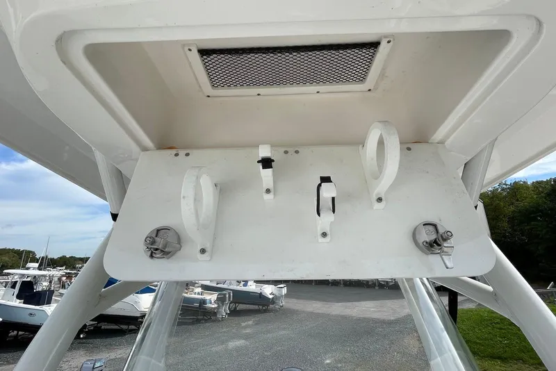 Slide: The Image of 2022 Sea Fox 228 Commander boat storage compartment with latches and ventilation. - 20