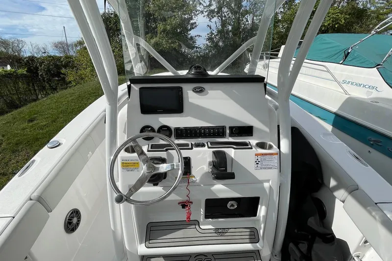 Slide: The Image of 2022 Sea Fox 228 Commander boat console with steering wheel and controls. - 26