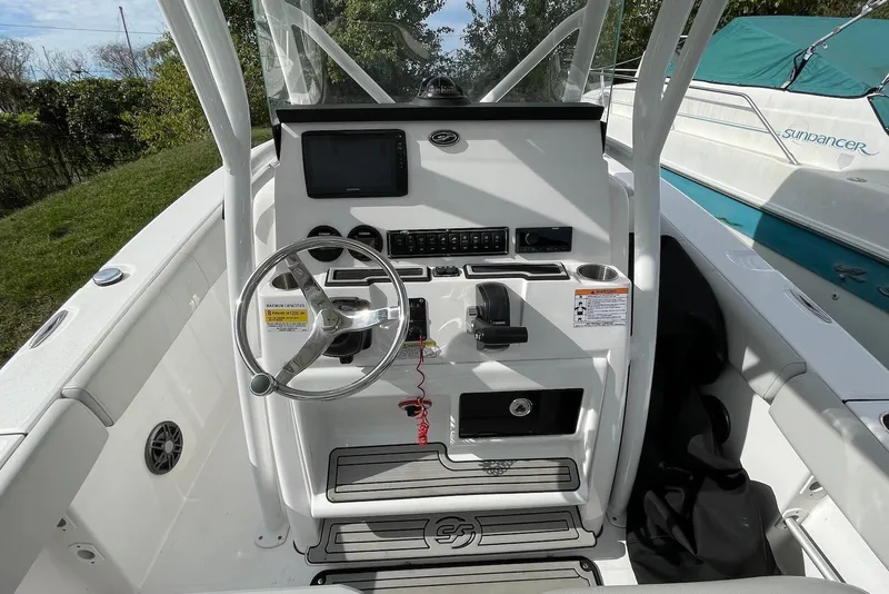 Slide: The Image of 2022 Sea Fox 228 Commander boat console with steering wheel and control panel. - 27