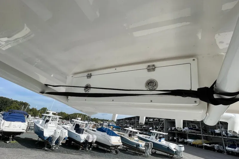 Slide: The Image of 2022 Sea Fox 228 Commander boat in storage, surrounded by other vessels. - 29