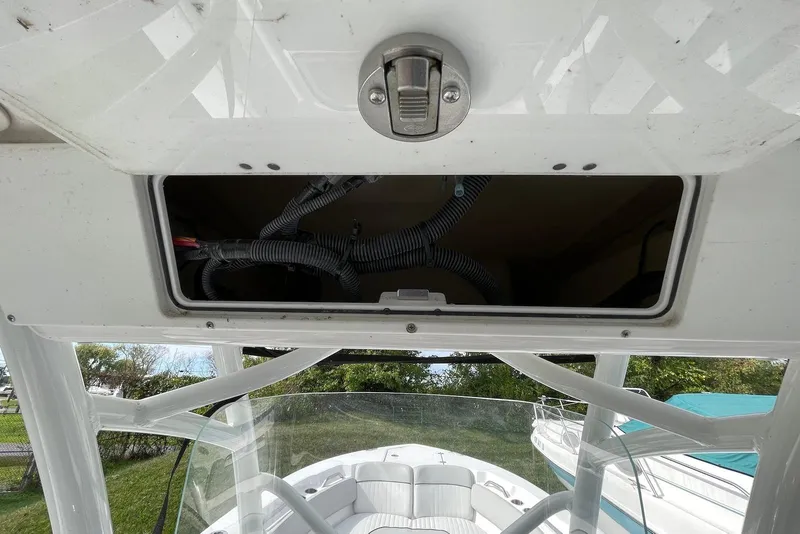 Slide: The Image of 2022 Sea Fox 228 Commander boat storage compartment with wiring, open view. - 31