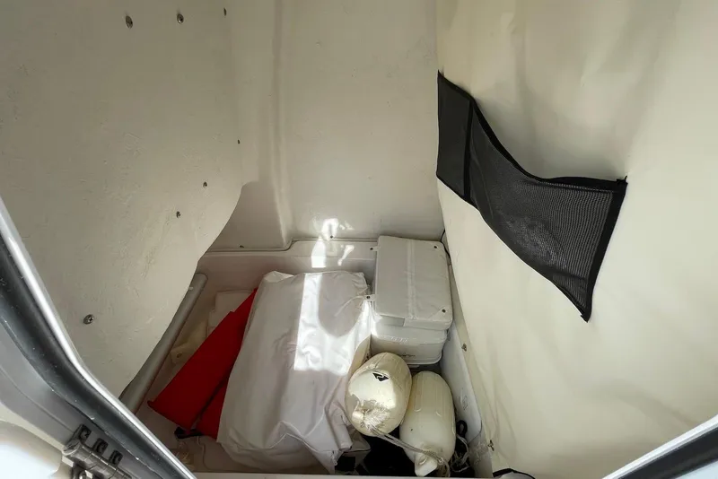 Slide: The Image of Interior storage compartment of 2022 Sea Fox 228 Commander boat with various equipment. - 32