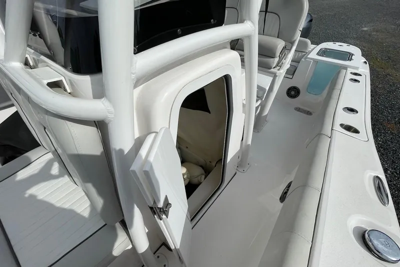 Slide: The Image of 2022 Sea Fox 228 Commander boat interior with open storage compartment and seating. - 34