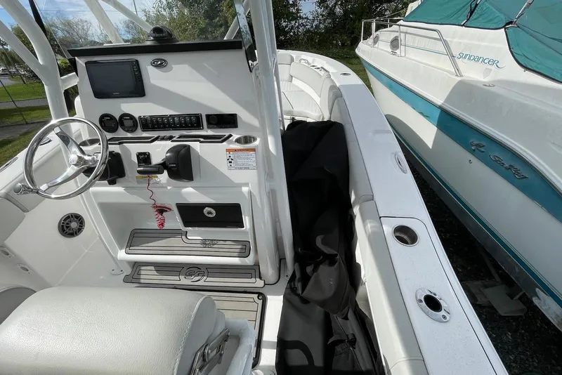 Slide: The Image of 2022 Sea Fox 228 Commander boat interior with steering console and seating area. - 35