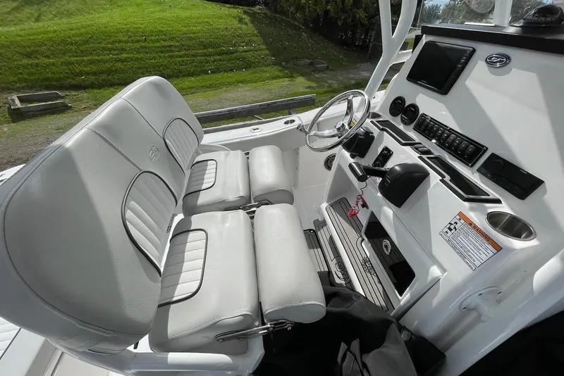 Slide: The Image of 2022 Sea Fox 228 Commander boat interior with dual seats and control panel. - 39