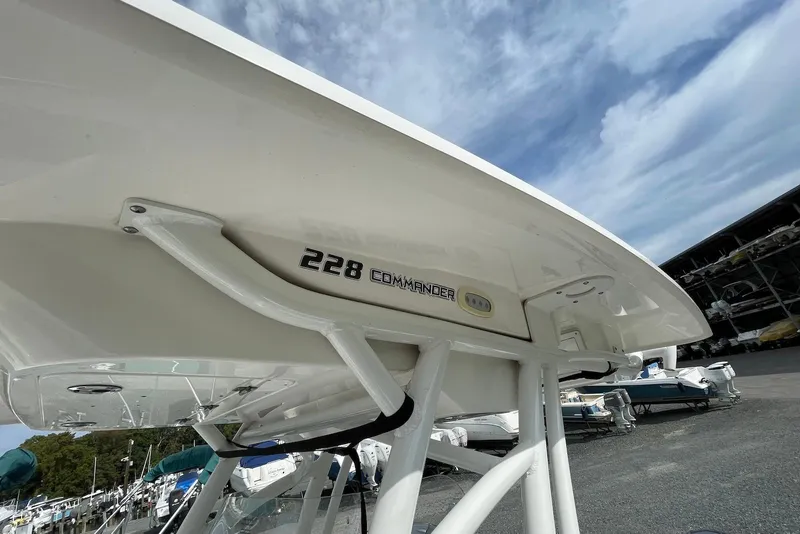 Slide: The Image of 2022 Sea Fox 228 Commander boat displayed in a marina under a clear sky. - 49