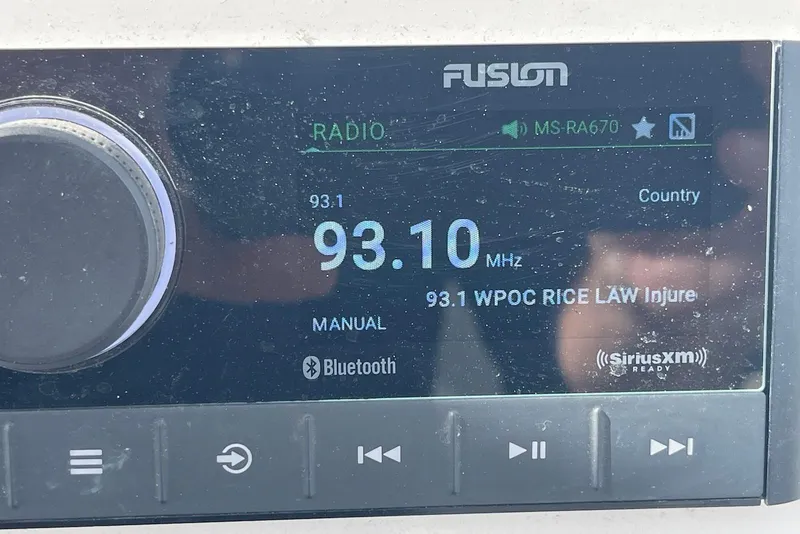 Slide: The Image of Radio display on a 2022 Sea Fox 228 Commander, tuned to 93.1 MHz. - 52