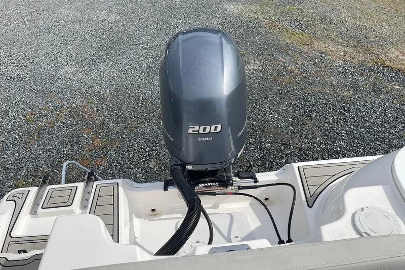 Slide: The Image of 2022 Sea Fox 228 Commander with Yamaha 200 outboard engine on gravel surface. - 54