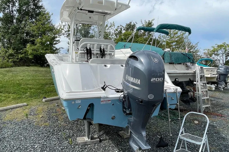 Slide: The Image of 2022 Sea Fox 228 Commander boat with Yamaha 200 engine, parked on gravel. - 57