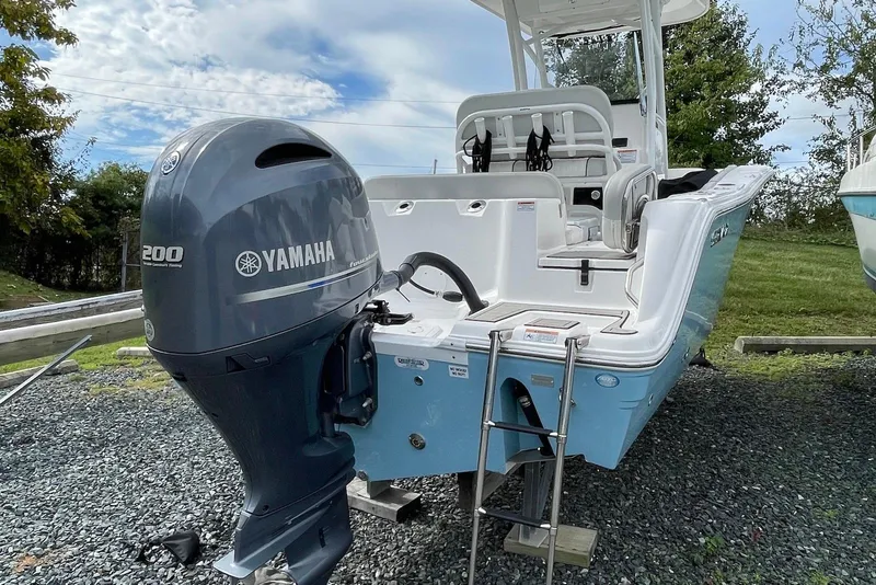 Slide: The Image of 2022 Sea Fox 228 Commander boat with Yamaha 200 engine, parked on gravel. - 58