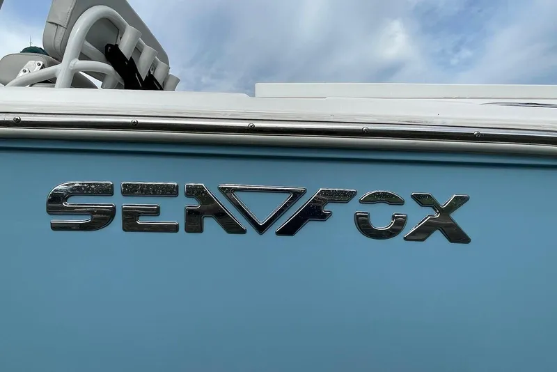 Slide: The Image of 2022 Sea Fox 228 Commander boat logo on light blue hull. - 62