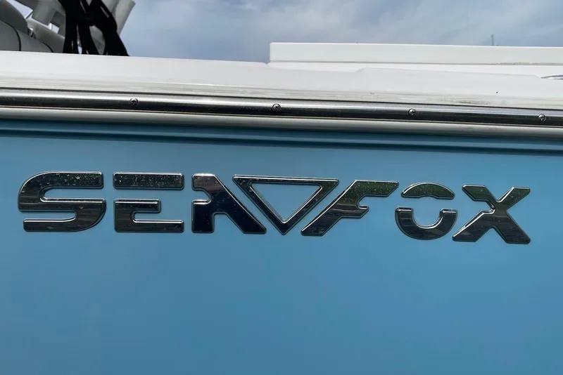 Slide: The Image of Sea Fox 228 Commander 2022 logo on blue boat exterior. - 63