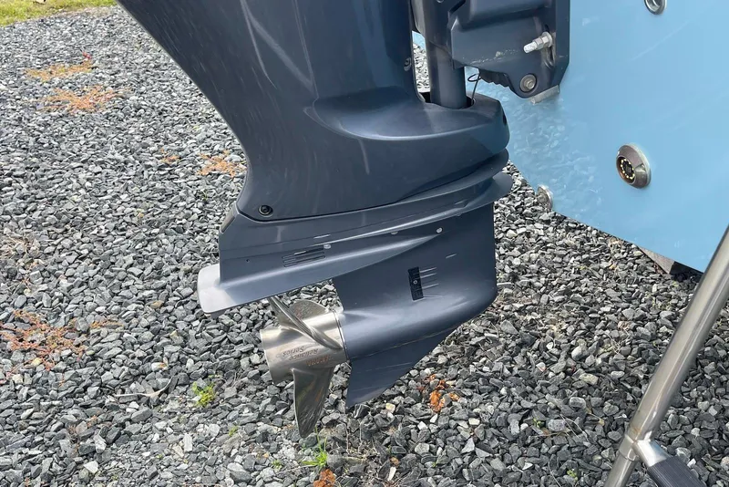 Slide: The Image of Outboard motor of 2022 Sea Fox 228 Commander on gravel surface. - 64