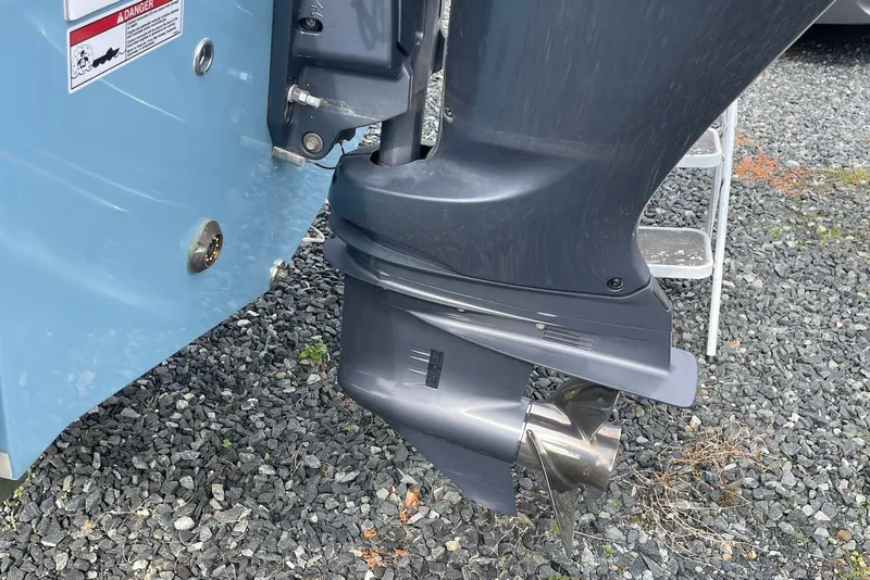 Slide: The Image of Outboard motor of 2022 Sea Fox 228 Commander on gravel surface. - 65