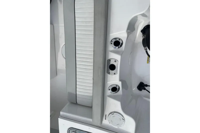 Slide: The Image of 2022 Sea Fox 228 Commander boat interior with rod holders and seating. - 66