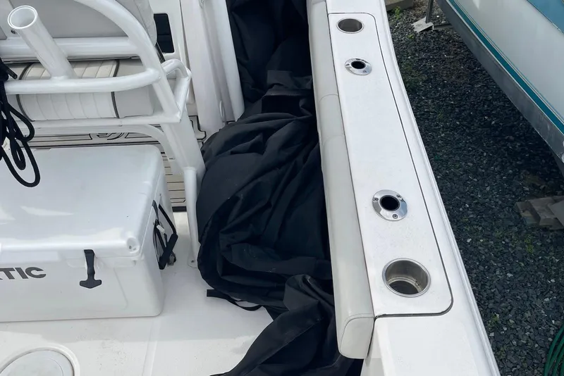 Slide: The Image of 2022 Sea Fox 228 Commander boat interior with rod holders and storage. - 67