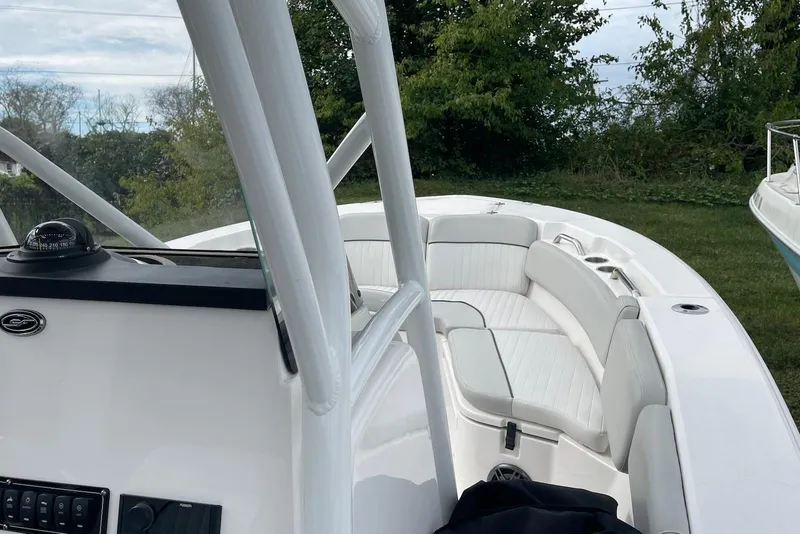 Slide: The Image of 2022 Sea Fox 228 Commander boat interior with white seating and navigation equipment. - 70