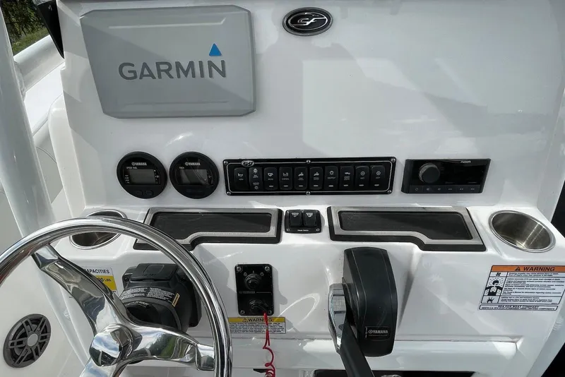 Slide: The Image of 2022 Sea Fox 228 Commander dashboard with Garmin navigation and Yamaha controls. - 73
