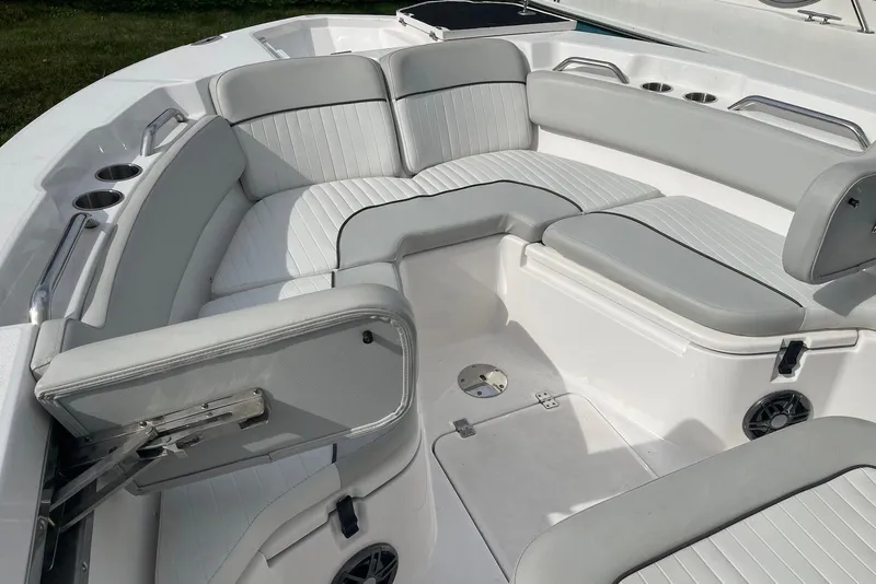 Slide: The Image of 2022 Sea Fox 228 Commander boat interior with cushioned seating and cup holders. - 9