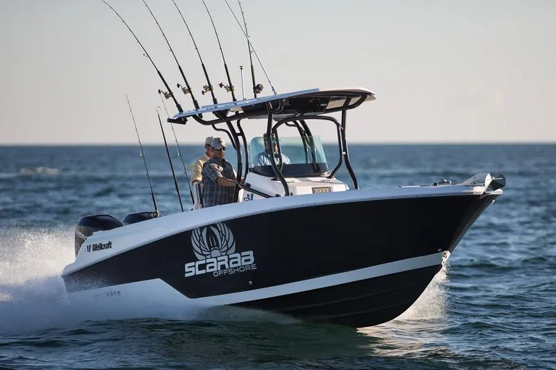 Slide: The Image of Manufacturer Provided Image: 2017 Wellcraft 262 Scarab Offshore boat cruising on the ocean with fishing rods. - 6