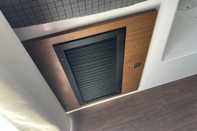 Slide: The Image of Ventilation panel on 2024 Jeanneau NC Weekender 895 boat interior. - 17