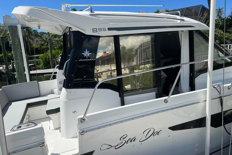 Slide: The Image of 2024 Jeanneau NC Weekender 895 docked, featuring sleek design and modern amenities. - 3
