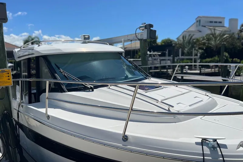 Slide: The Image of 2024 Jeanneau NC Weekender 895 docked, showcasing sleek design and modern features. - 4