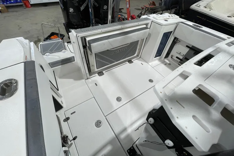 Slide: The Image of 2019 Blackfin 272 CC boat interior with spacious deck and storage compartments. - 20