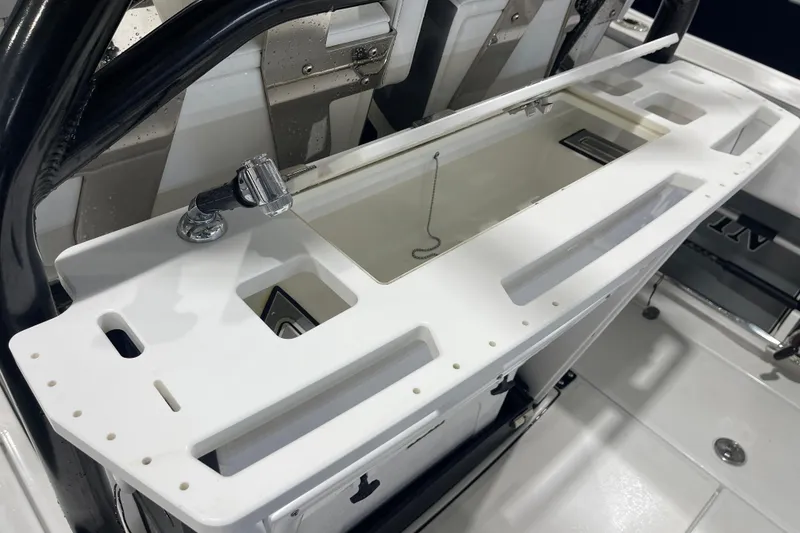 Slide: The Image of 2019 Blackfin 272 CC boat interior with white console and faucet. - 22