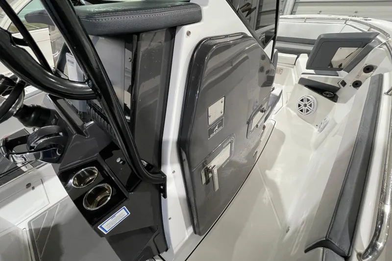 Slide: The Image of 2019 Blackfin 272 CC boat interior with steering console and seating area. - 24