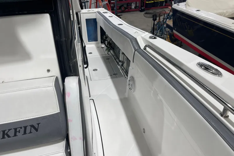 Slide: The Image of 2019 Blackfin 272 CC boat interior with seating and storage compartments. - 33
