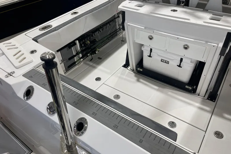 Slide: The Image of 2019 Blackfin 272 CC boat deck with Yeti cooler and fishing rod holders. - 38