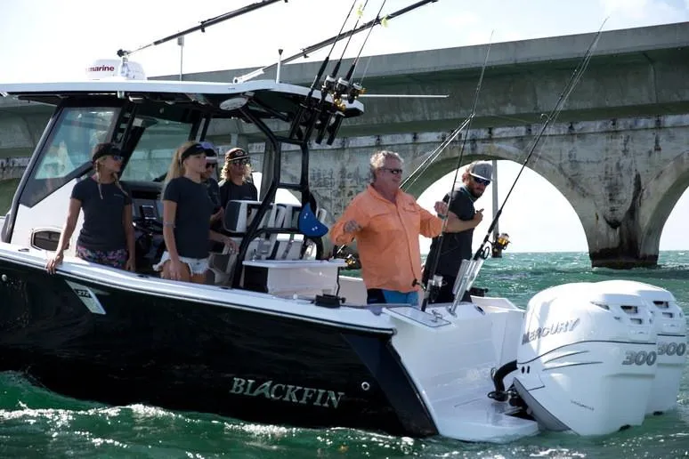 Slide: The Image of 2019 Blackfin 272 CC boat for sale in showroom with Volvo Penta banner. - 5