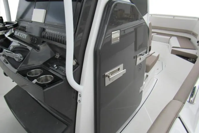Slide: The Image of 2019 Blackfin 272 CC boat in a garage, showcasing sleek design and modern features. - 9