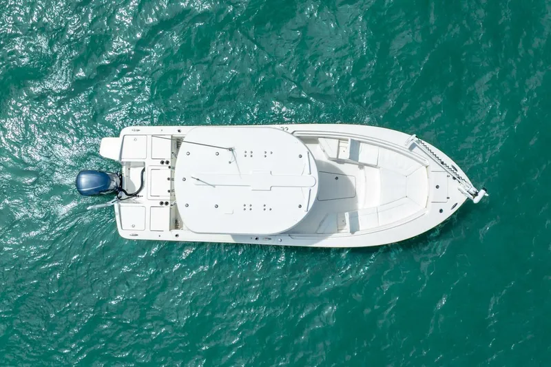 Slide: The Image of Aerial view of 2021 Regulator 26XO boat on turquoise water. - 17