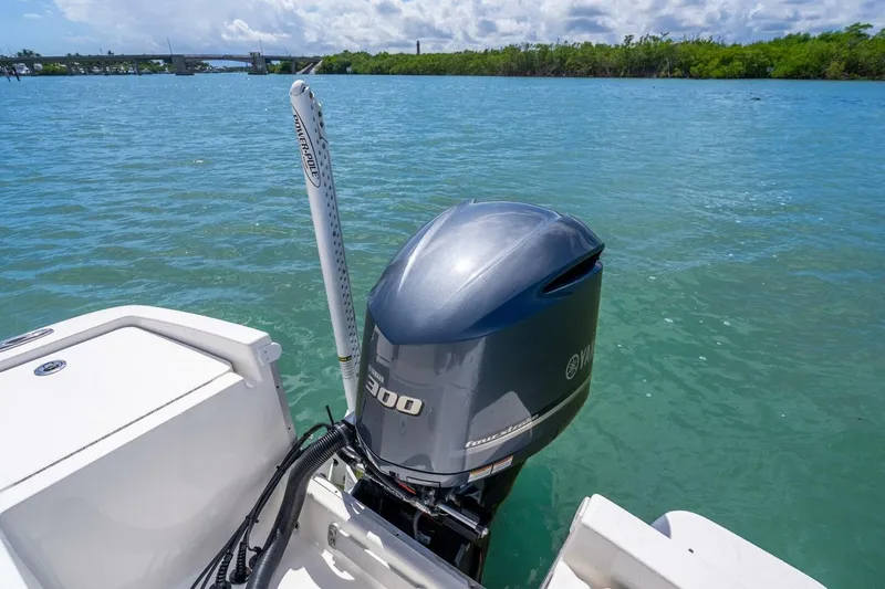 Slide: The Image of 2021 Regulator 26XO boat with Yamaha 300 outboard motor on clear blue water. - 29