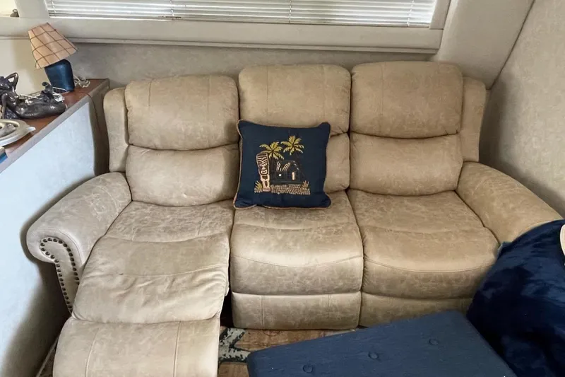 Slide: The Image of Beige leather sofa with decorative pillow inside 1997 Silverton 402 Motor Yacht cabin. - 17