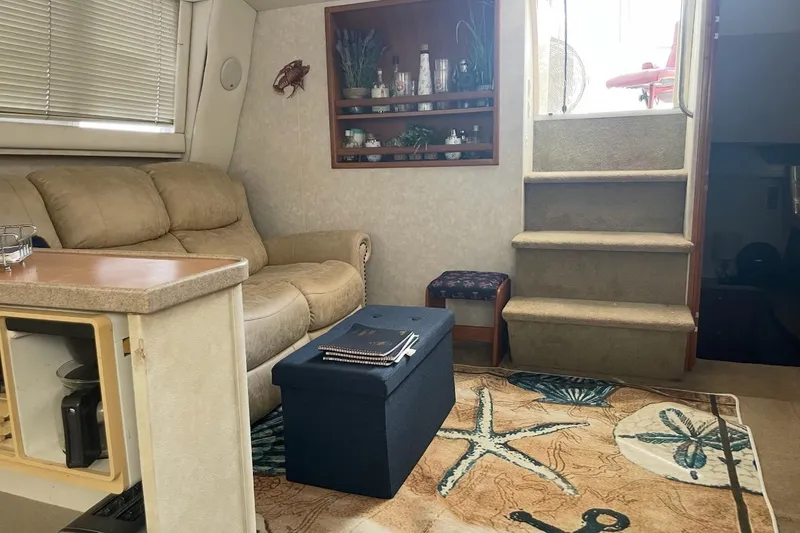 Slide: The Image of Interior of 1997 Silverton 402 Motor Yacht with cozy seating and nautical decor. - 18