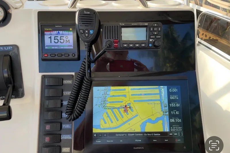 Slide: The Image of Control panel of a 1997 Silverton 402 Motor Yacht with navigation and communication equipment. - 24