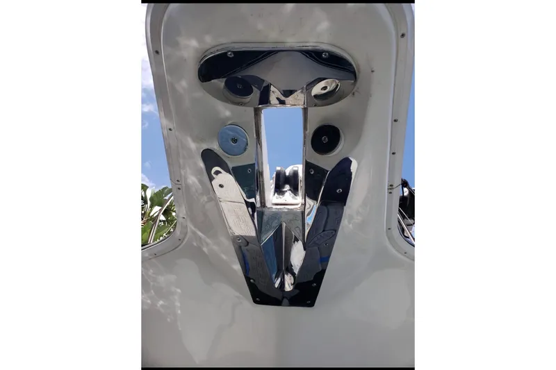 Slide: The Image of 1997 Silverton 402 Motor Yacht, polished metal details, viewed from below against blue sky. - 3