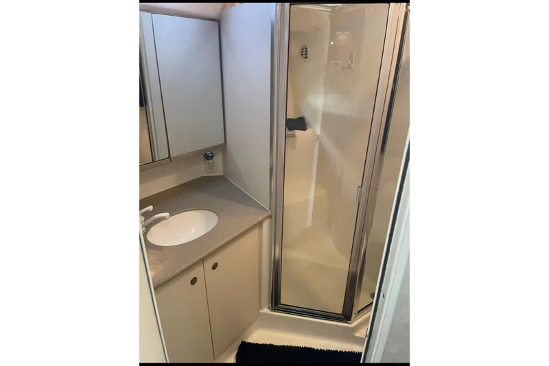Slide: The Image of Bathroom interior of 1997 Silverton 402 Motor Yacht with shower and sink. - 7