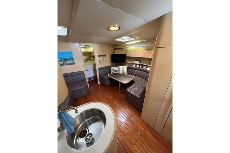 Slide: The Image of Luxurious interior of 1992 Tiara Yachts 4300 Open with wood flooring and modern amenities. - 10