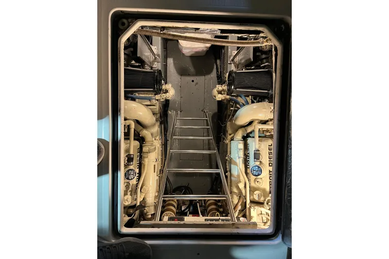 Slide: The Image of Engine room of a 1992 Tiara Yachts 4300 Open, featuring Detroit Diesel engines. - 14