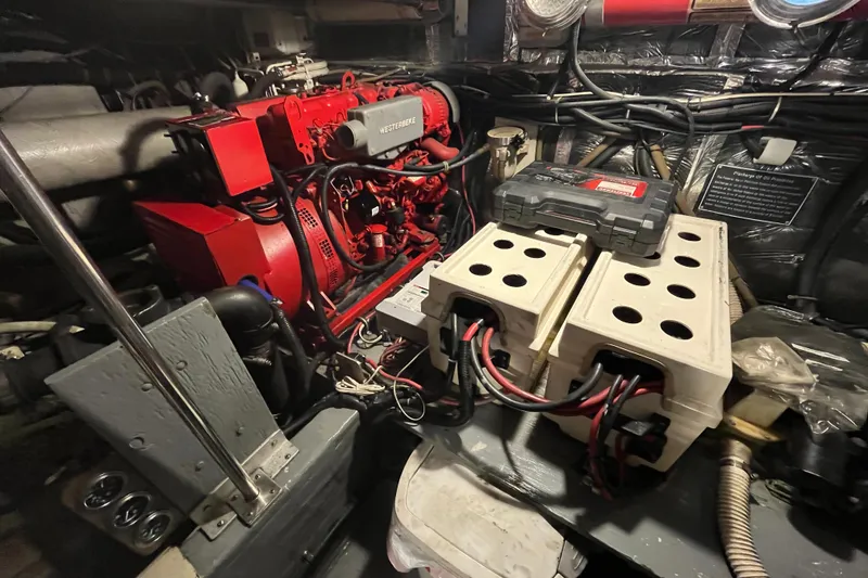Slide: The Image of Engine room of 1992 Tiara Yachts 4300 Open with Westerbeke generator and battery setup. - 18