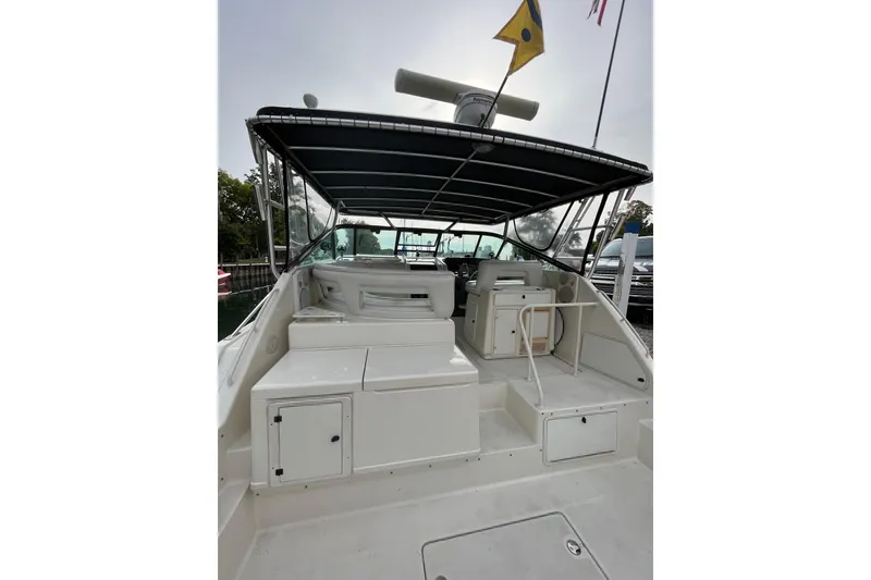 Slide: The Image of 1992 Tiara Yachts 4300 Open boat interior with seating and canopy. - 3