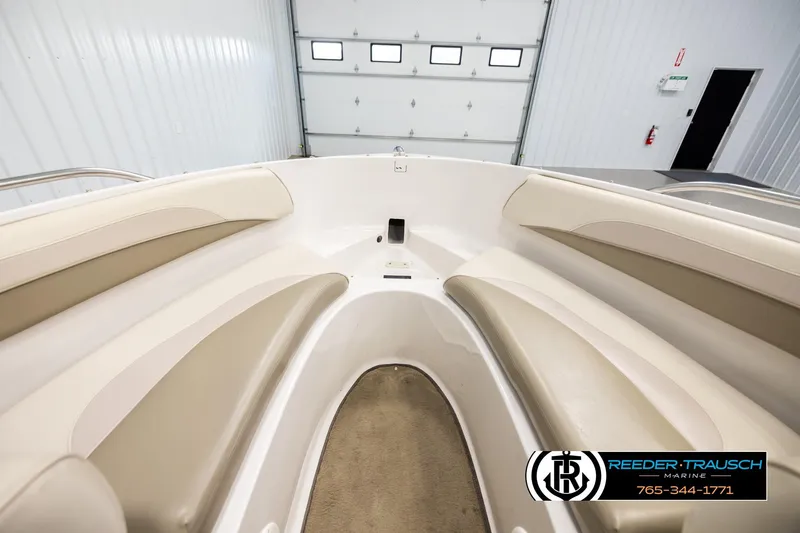Slide: The Image of Interior view of 1999 Four Winns 180 Horizon boat with beige seating. - 14
