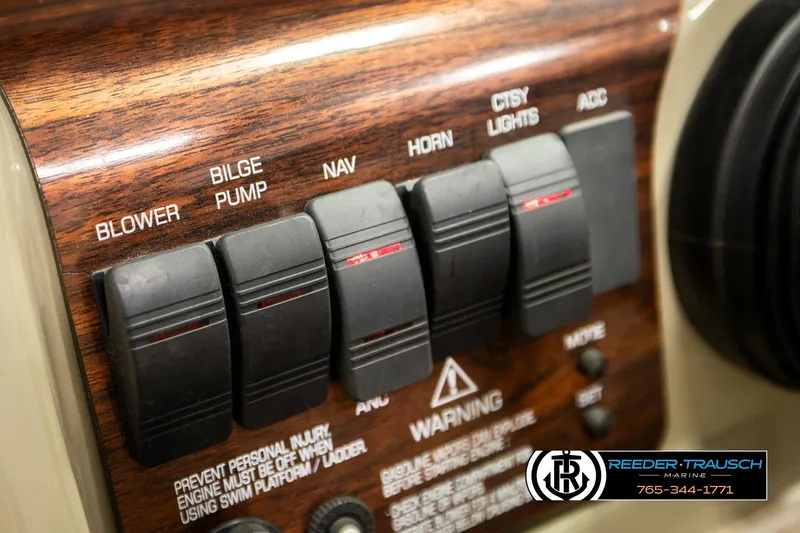 Slide: The Image of 1999 Four Winns 180 Horizon dashboard switches for blower, bilge pump, navigation, and more. - 24