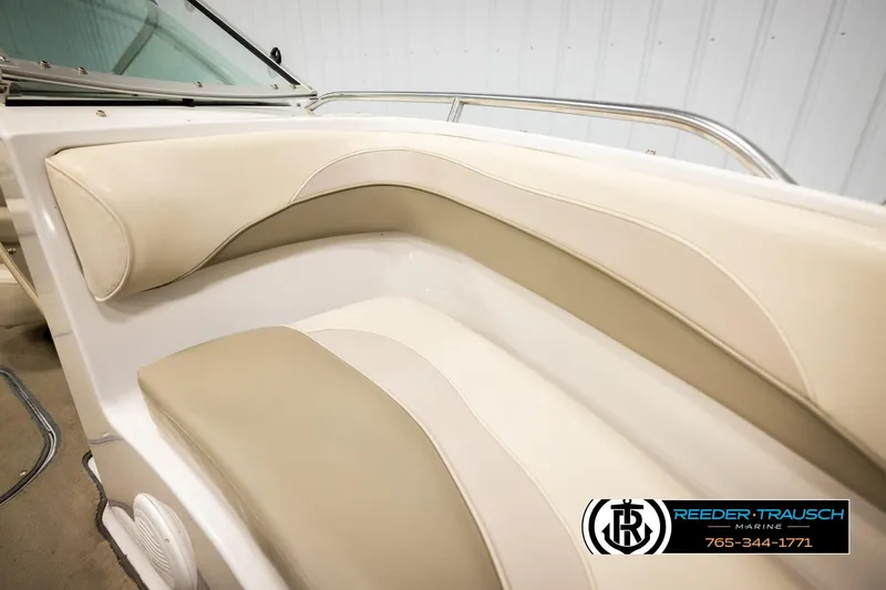 Slide: The Image of 1999 Four Winns 180 Horizon boat interior with beige and cream seating. - 30