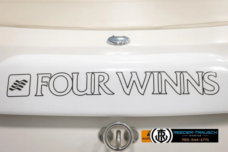 Slide: The Image of 1999 Four Winns 180 Horizon boat logo with Reeder-Trausch Marine branding. - 42