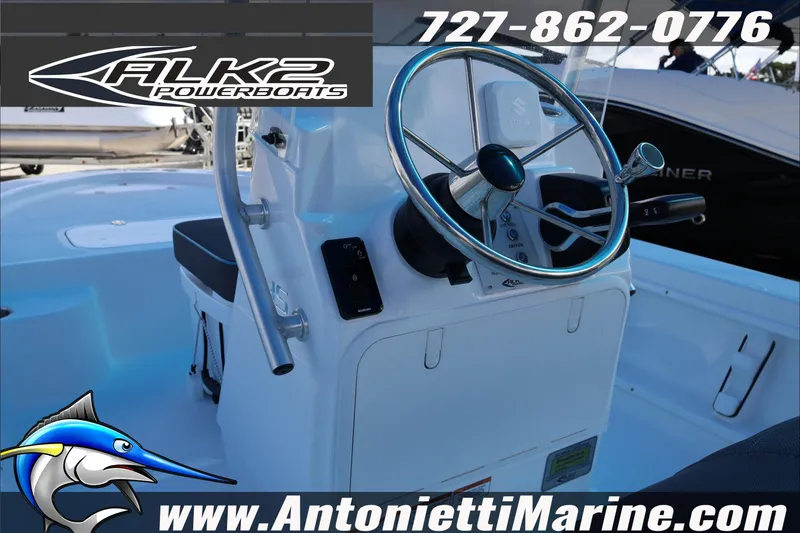 Slide: The Image of 2026 ALK2 Powerboats 17HS steering console with logo and contact details. - 12